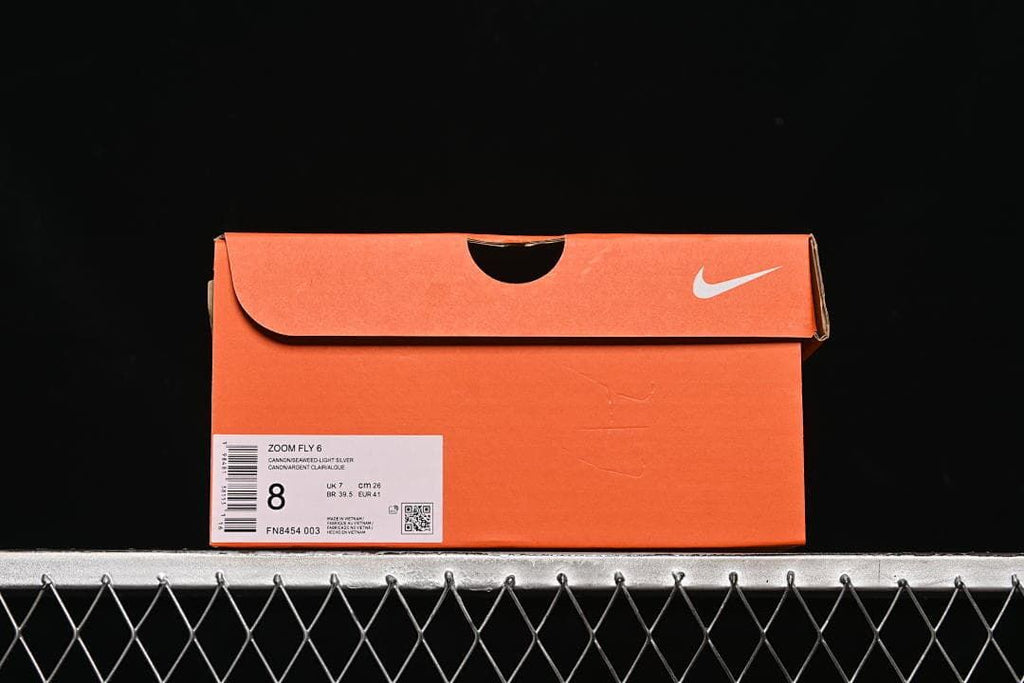 Orange shoe box label identifying Zoom Fly 6, style code FN8454-003, and sample size UK 7, EU 41, and CM 26