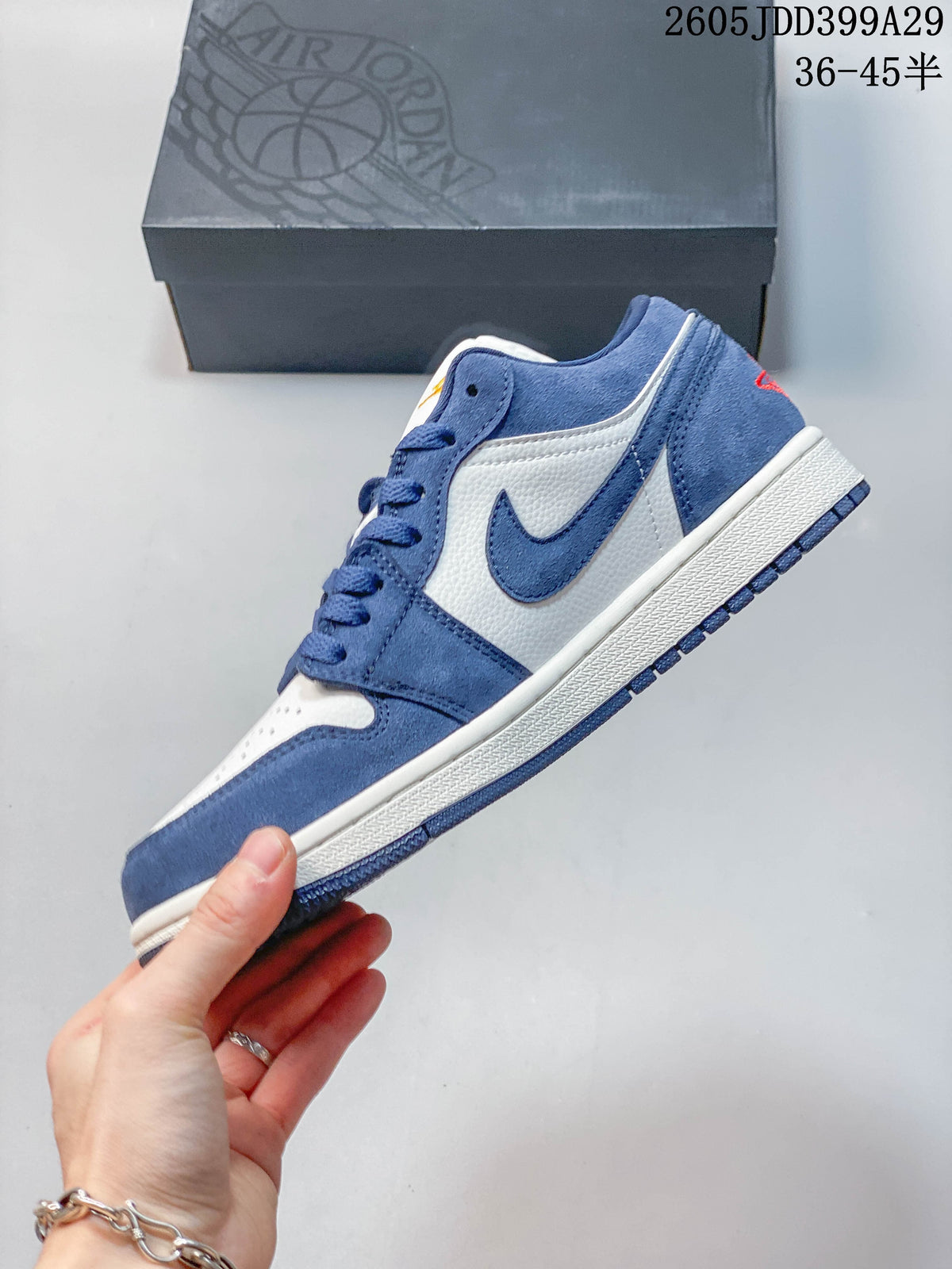 Side view of a blue and white low-top sneaker
