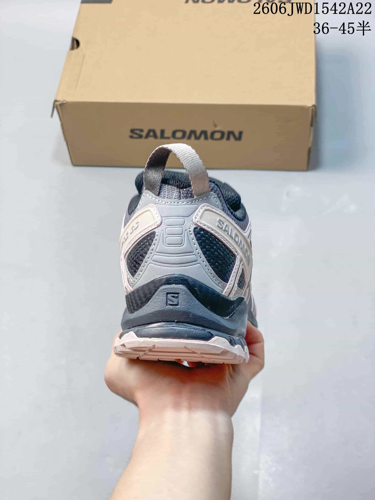 Rear view showing the heel structure and pull tab of a Salomon sneaker