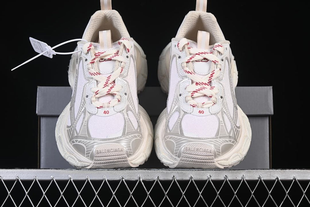 Front view of the pair showing patterned laces and layered toe panels