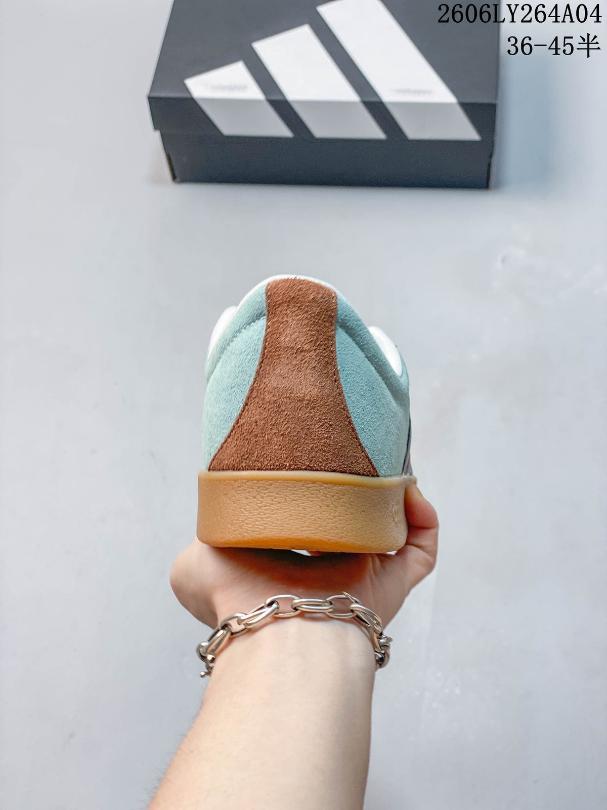 Rear view showing the blue upper, brown heel accent, and gum-colored sole