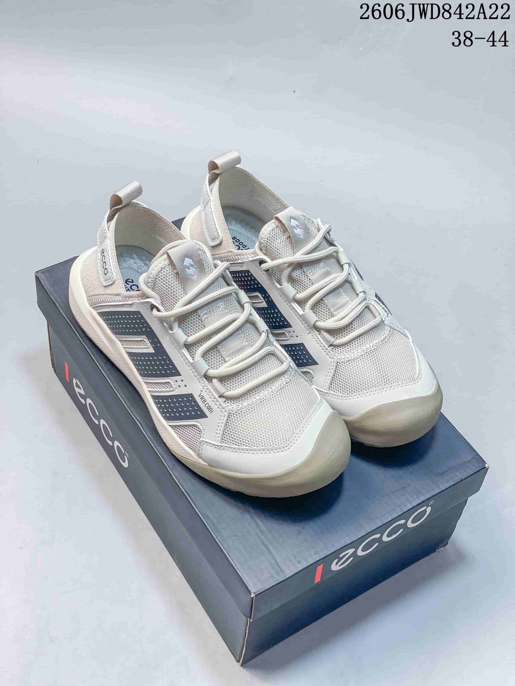 Pair of light grey ECCO mesh-style sneakers with dark side panels displayed on a branded shoe box.