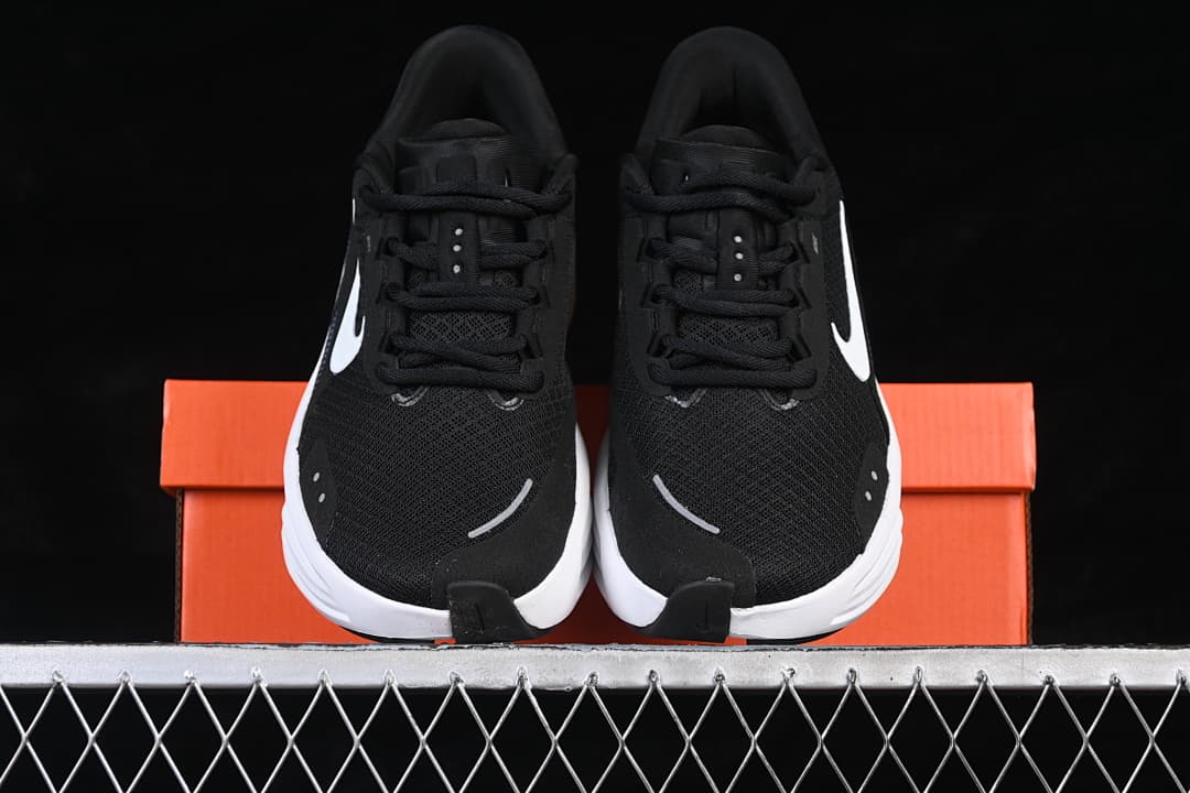 Front view of the pair showing black uppers and white Swoosh detailing.