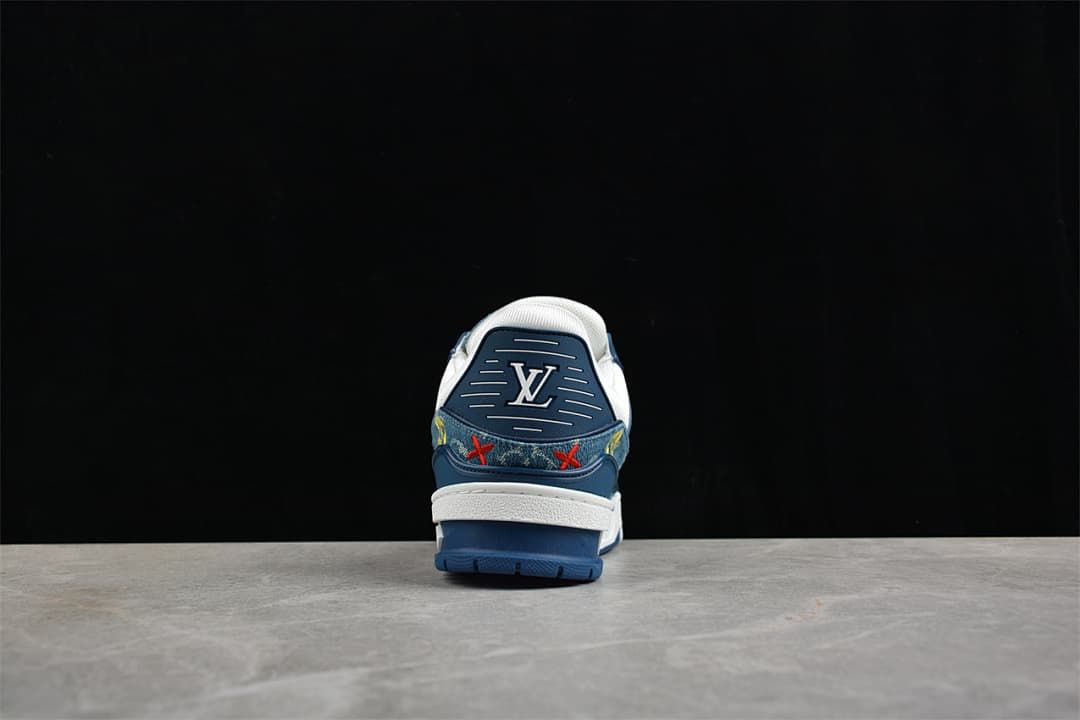 Rear view of a blue sneaker with a white collar, heel logo and blue outsole.