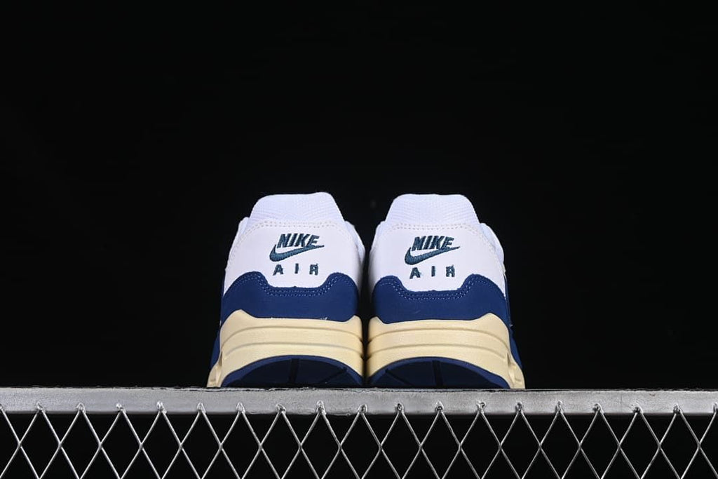 Rear view of both shoes with Nike Air heel details