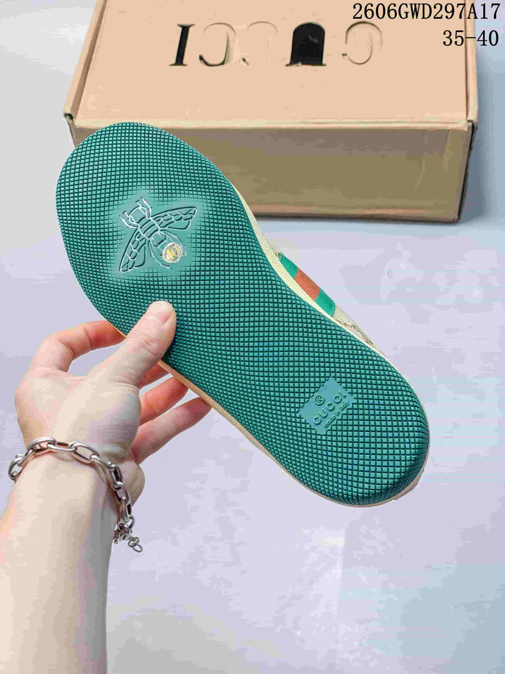 Textured dark green outsole of a Gucci Screener-style mule sneaker