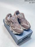 Pair of mauve and grey New Balance 9060 sneakers on a shoebox, shown from above at an angle.