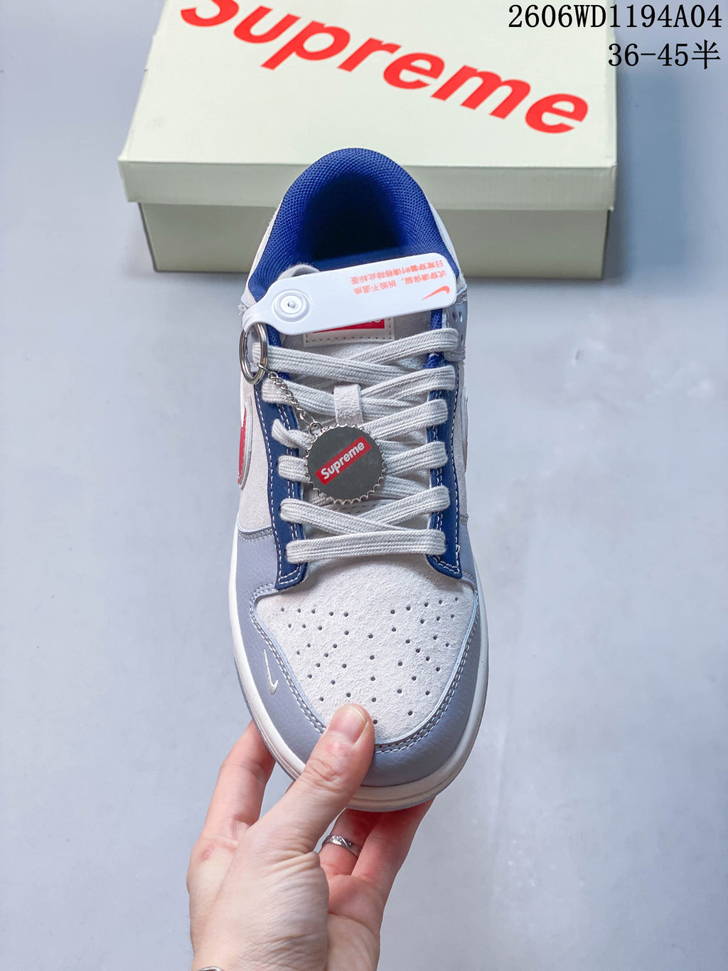 Top view showing perforated toe, white laces, and decorative lace accessories