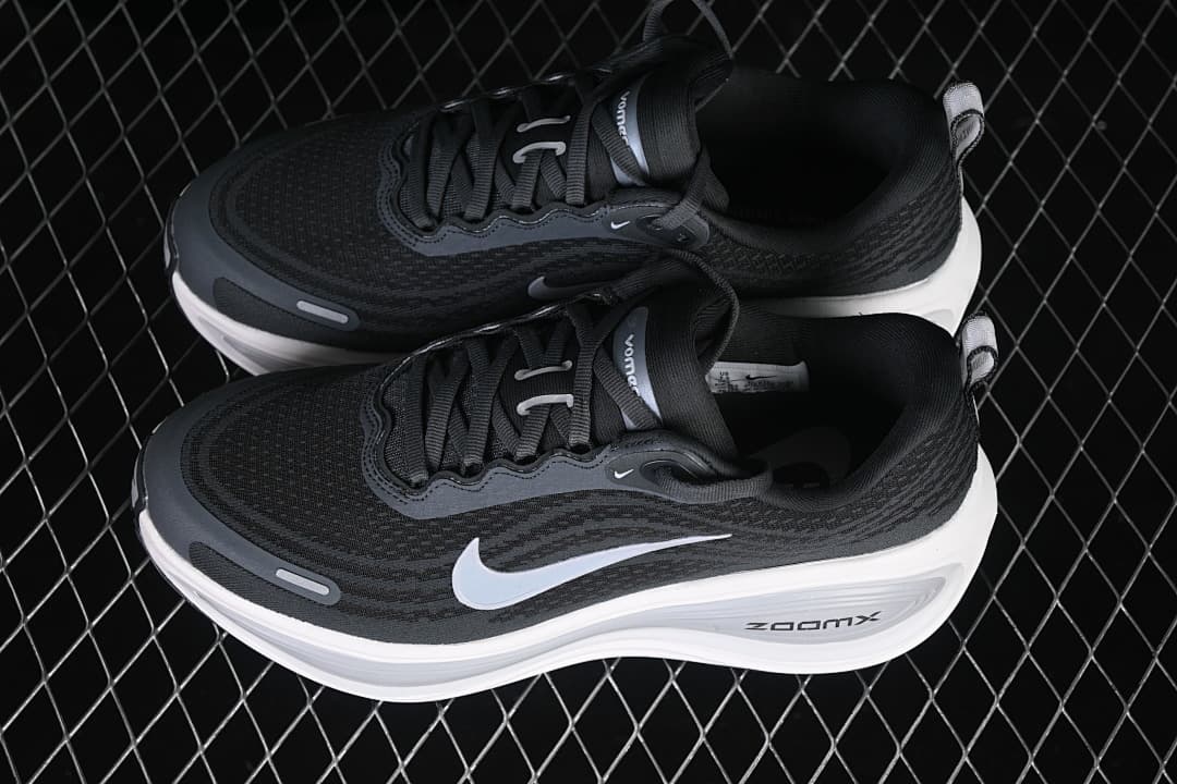 Pair of dark Nike Vomero Plus running shoes shown from above at an angle.