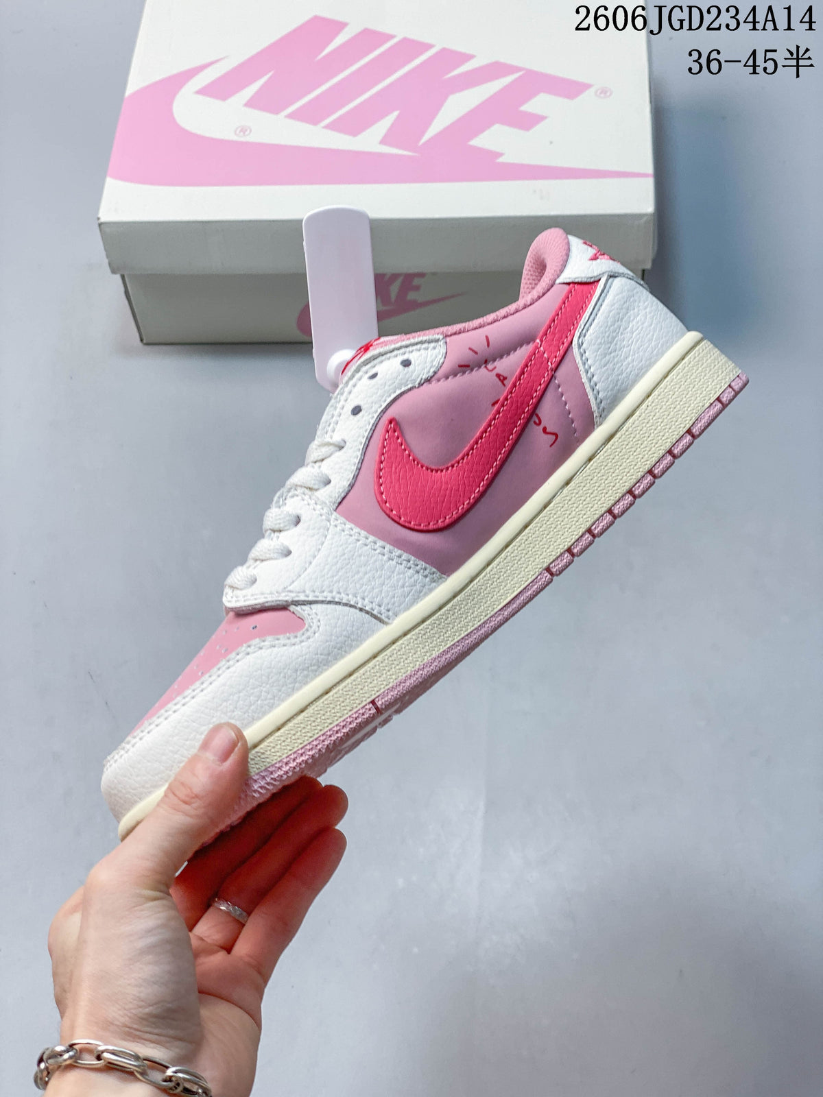 Side view of the pink and white low-top sneaker with a bright-pink Swoosh