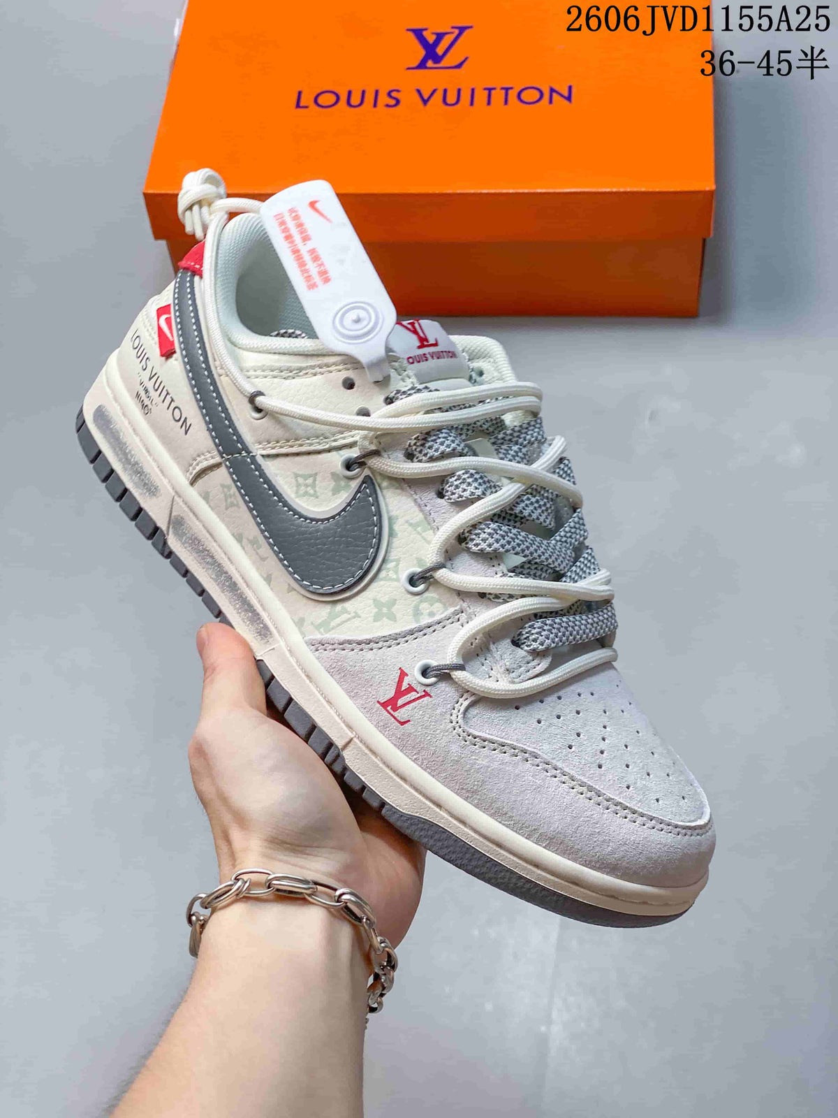 Close view of a white and gray low-top sneaker with a dark swoosh and patterned side panels