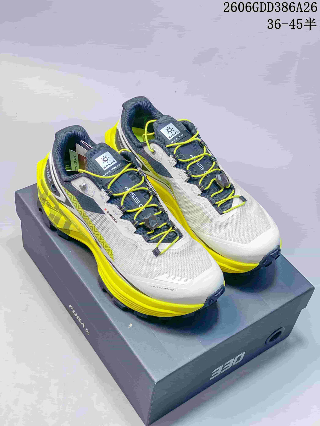 White and gray KAILAS FUGA EX330 trail shoes with bright yellow laces and yellow outsole details