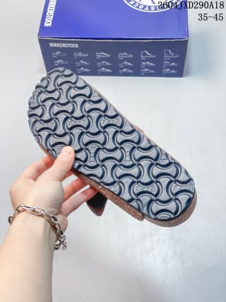 Underside view showing the clog's patterned textured outsole.
