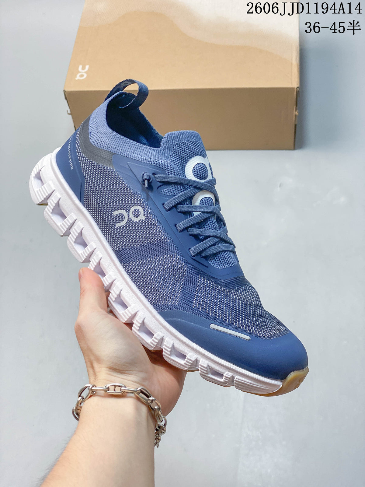 Close-up of a blue On Cloud 6 Versa shoe showing its side details and outsole