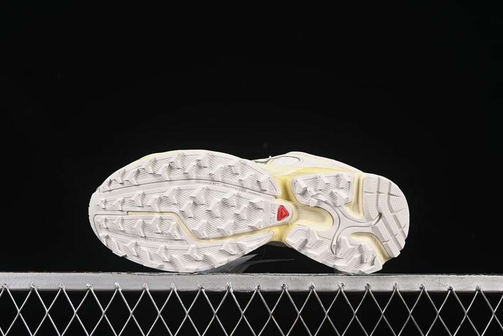 Underside showing the shoes' lugged outsoles
