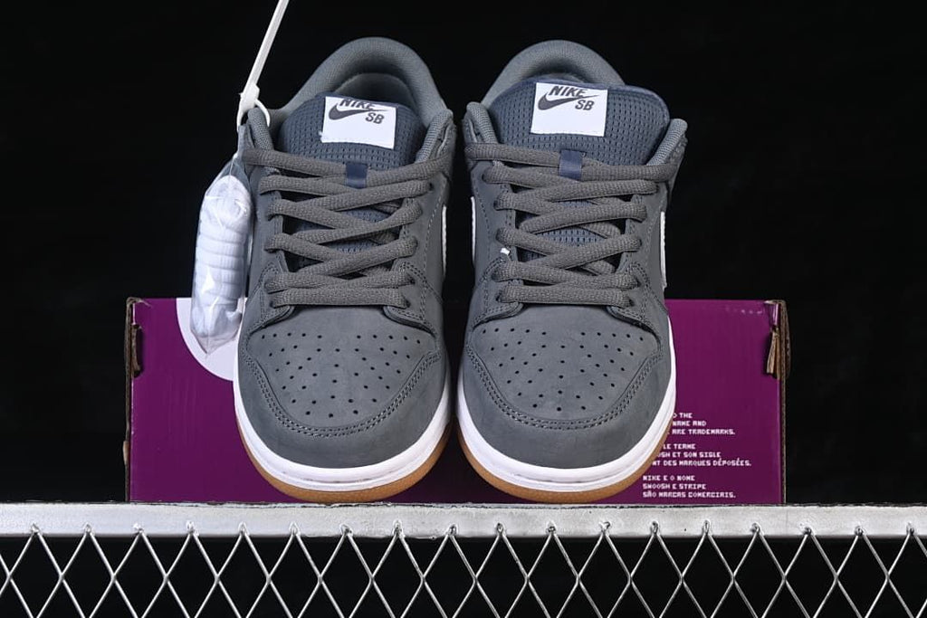 Front view of the pair showing the perforated toes, gray laces, and tongue labels.