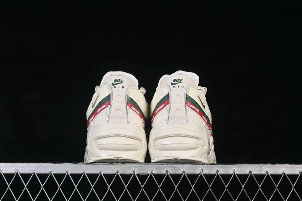 Rear view of both shoes, showing heel panels and visible Air units.