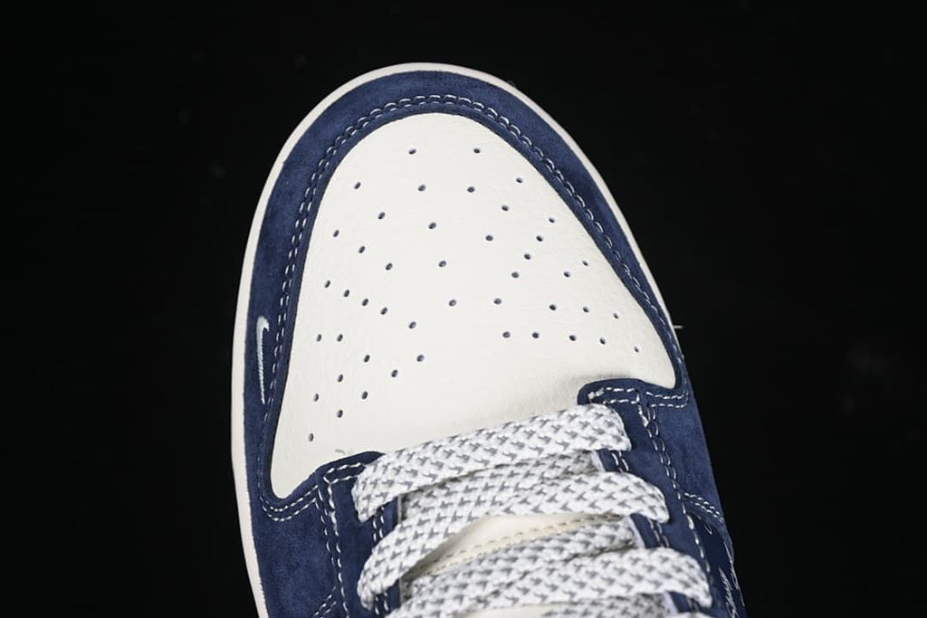Top view of the perforated white toe box and patterned laces