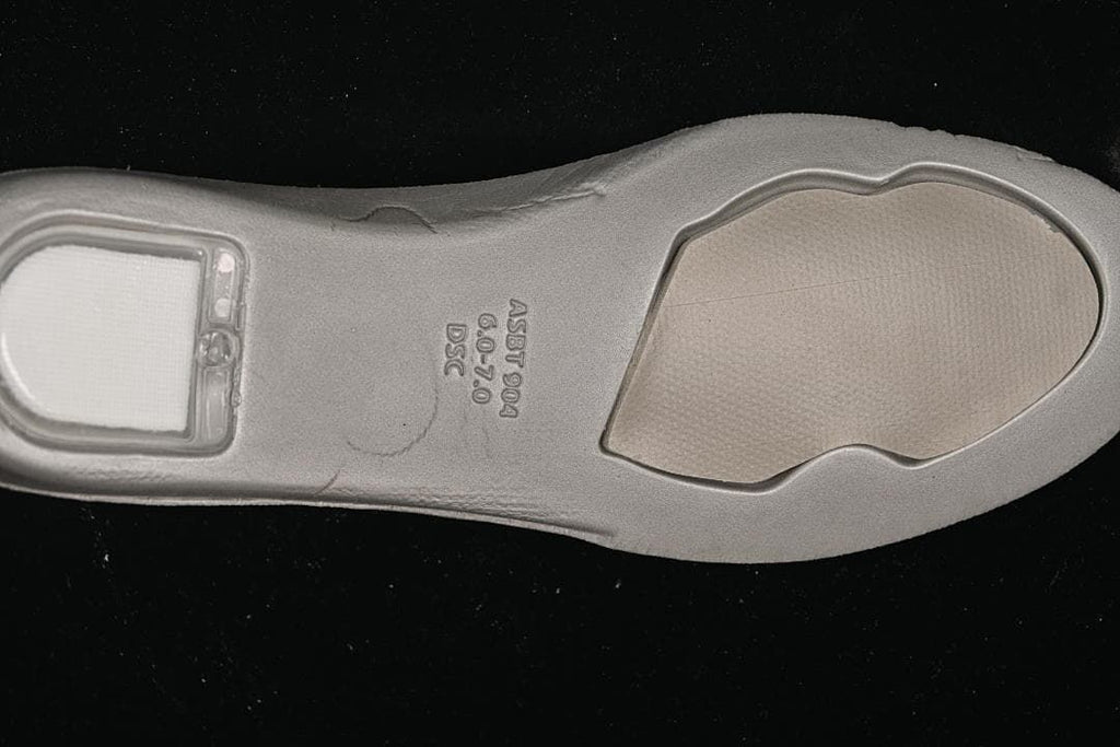 Outsole detail with molded lettering and size markings