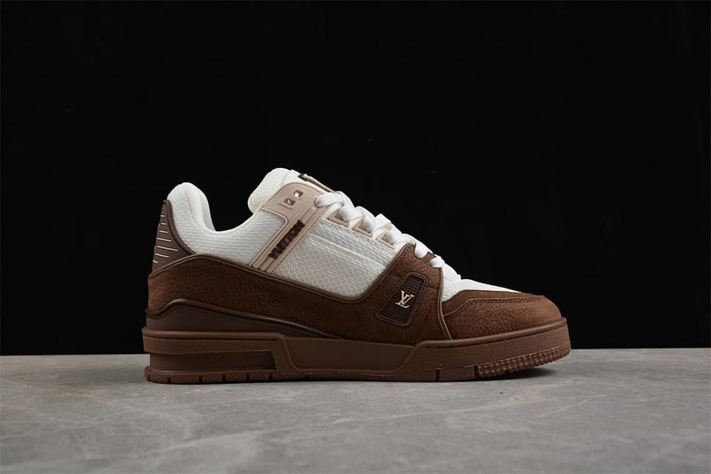 Side profile showing white upper panels, brown overlays, and sculpted sole.
