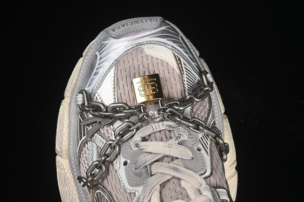 Top view of the sneaker with laces and chain across the upper.