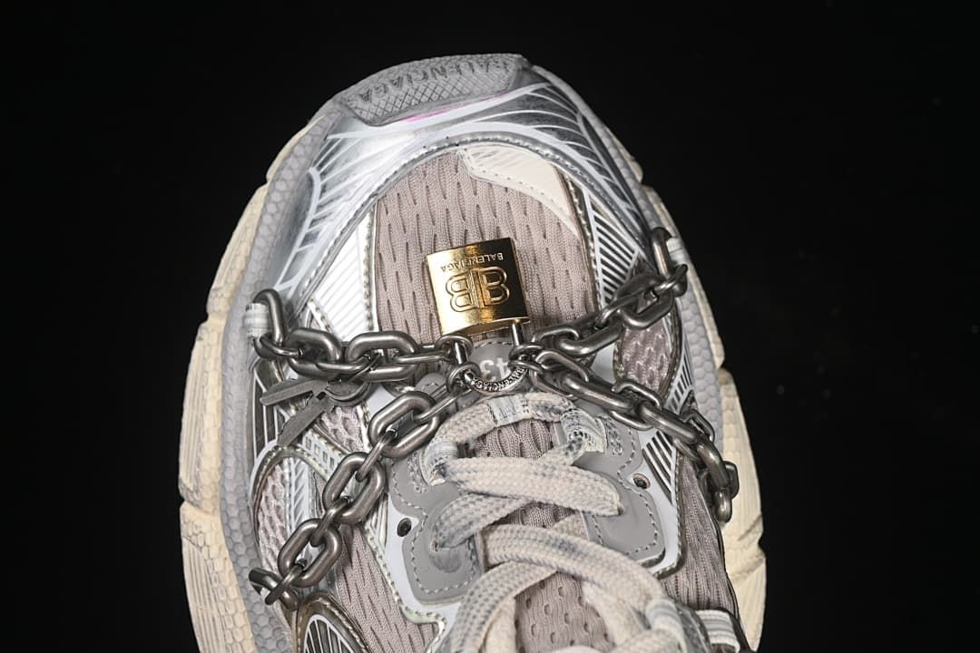 Top view of the sneaker with laces and chain across the upper.