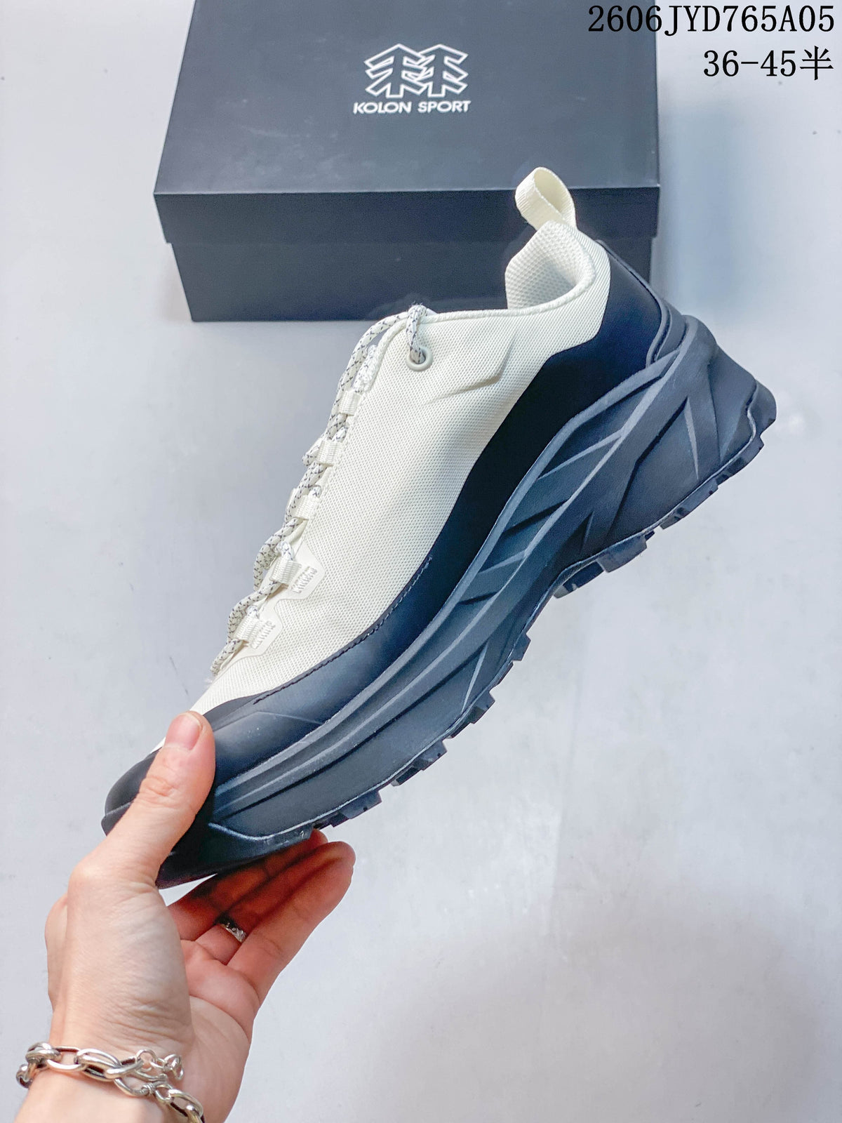 Side profile of the ivory and charcoal Kolon Sport approach hiking shoe.