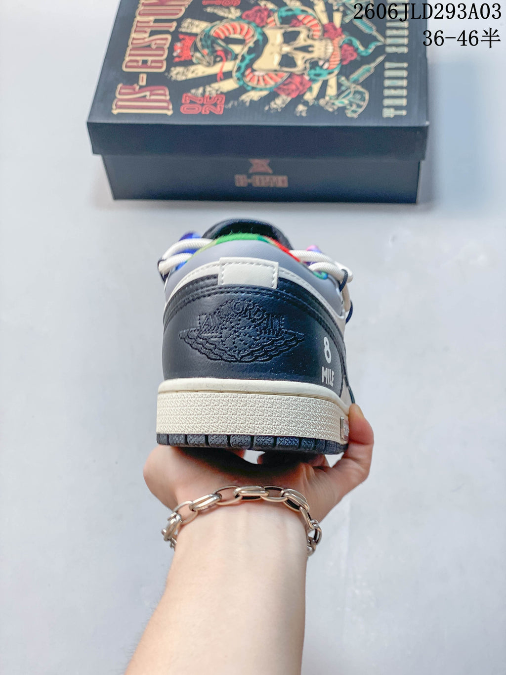 Rear view of the Jordan sneaker showing navy heel panels and graphic details
