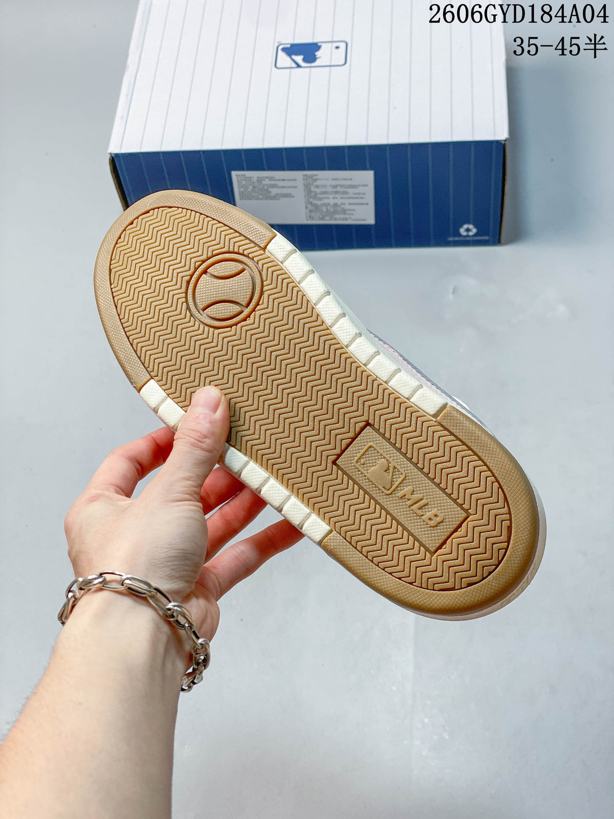 Close-up of the sneaker outsole with a patterned tread and MLB mark