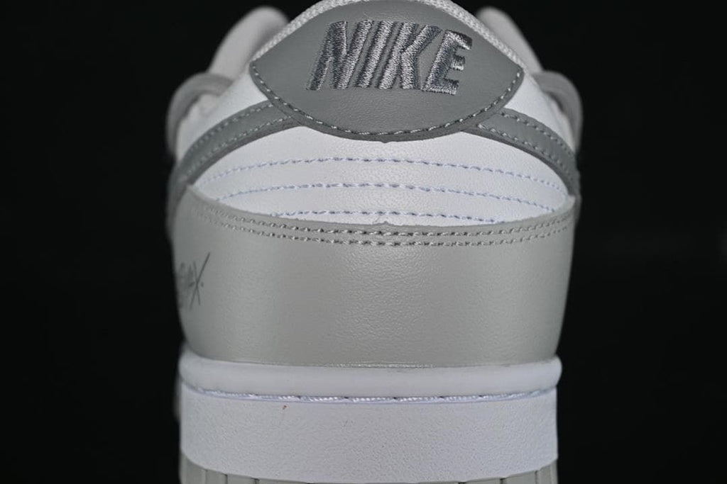 Rear view of the sneaker with grey heel panel and logo