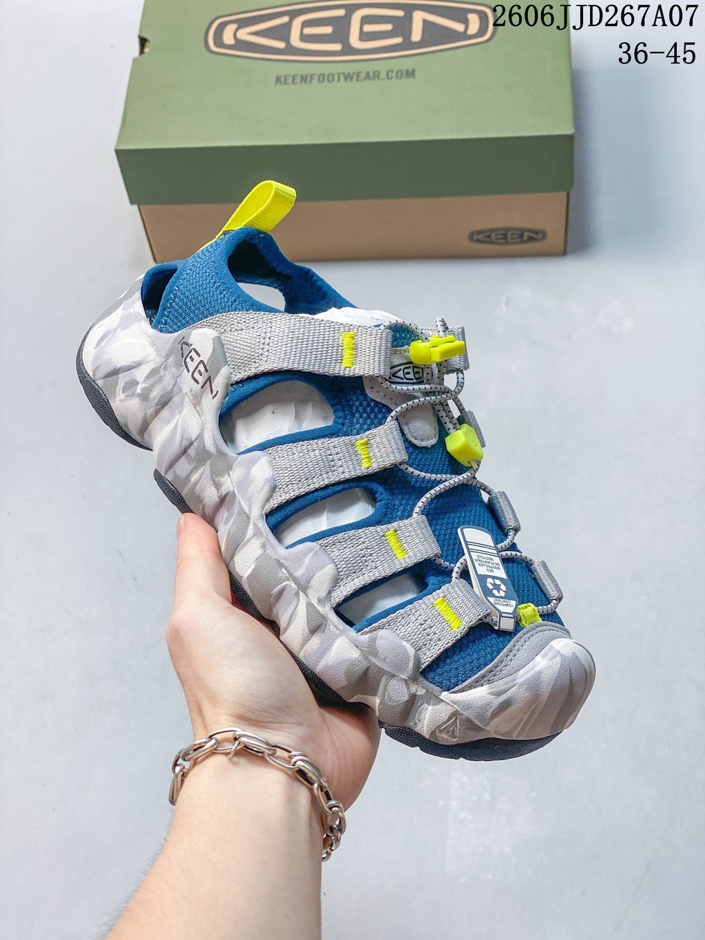 Angled view of the blue, gray, and yellow sandal upper