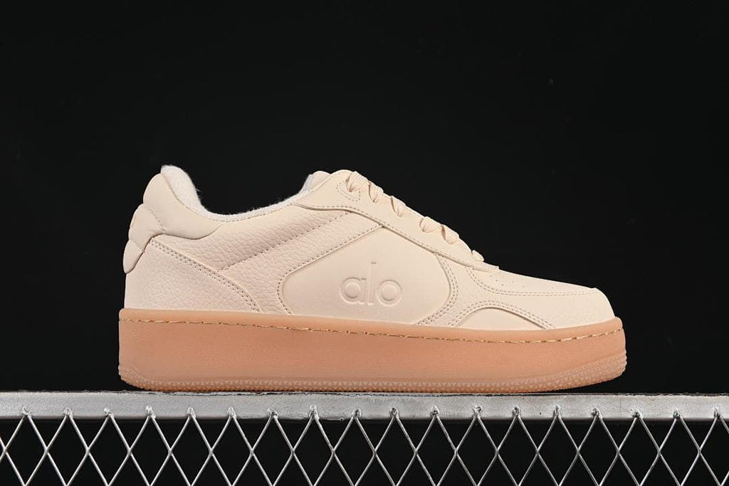 Side profile highlighting the low-top silhouette and thick gum-tone sole