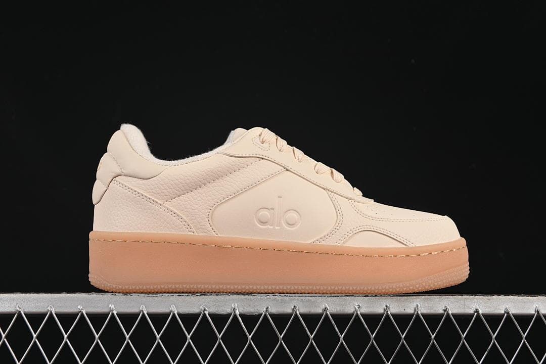 Side profile highlighting the low-top silhouette and thick gum-tone sole