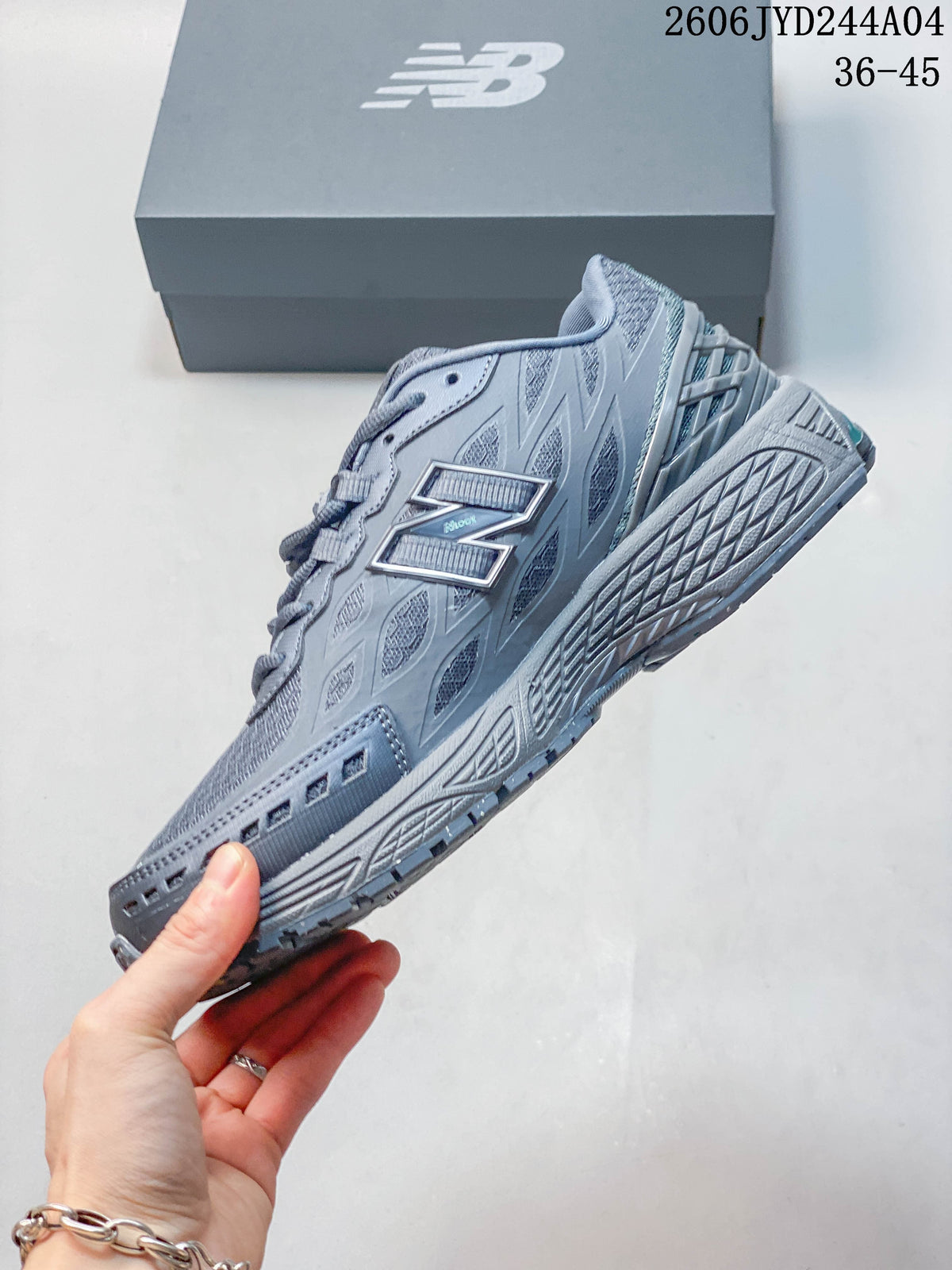 Side view of a gray New Balance sneaker showing its layered panels