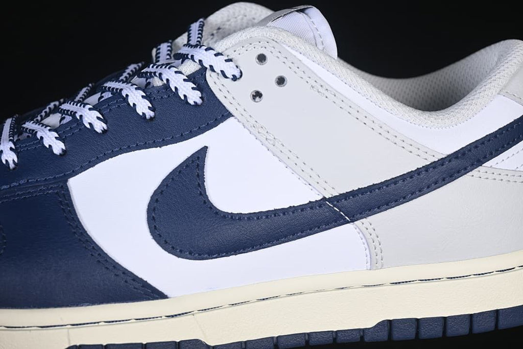 Close-up of the navy Swoosh and color-blocked side panels
