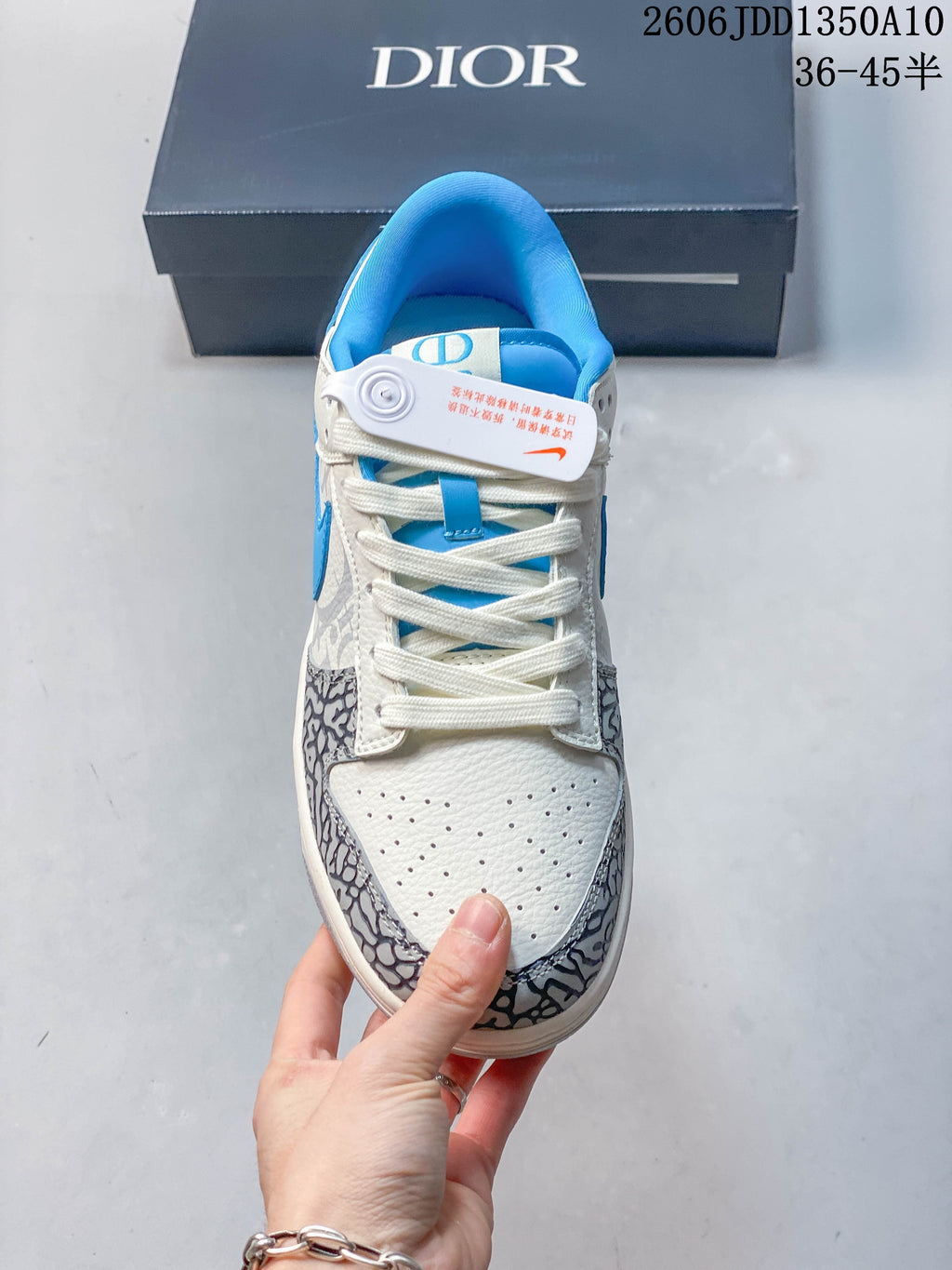 Front view showing the perforated toe, lace-up fastening, and patterned overlays.
