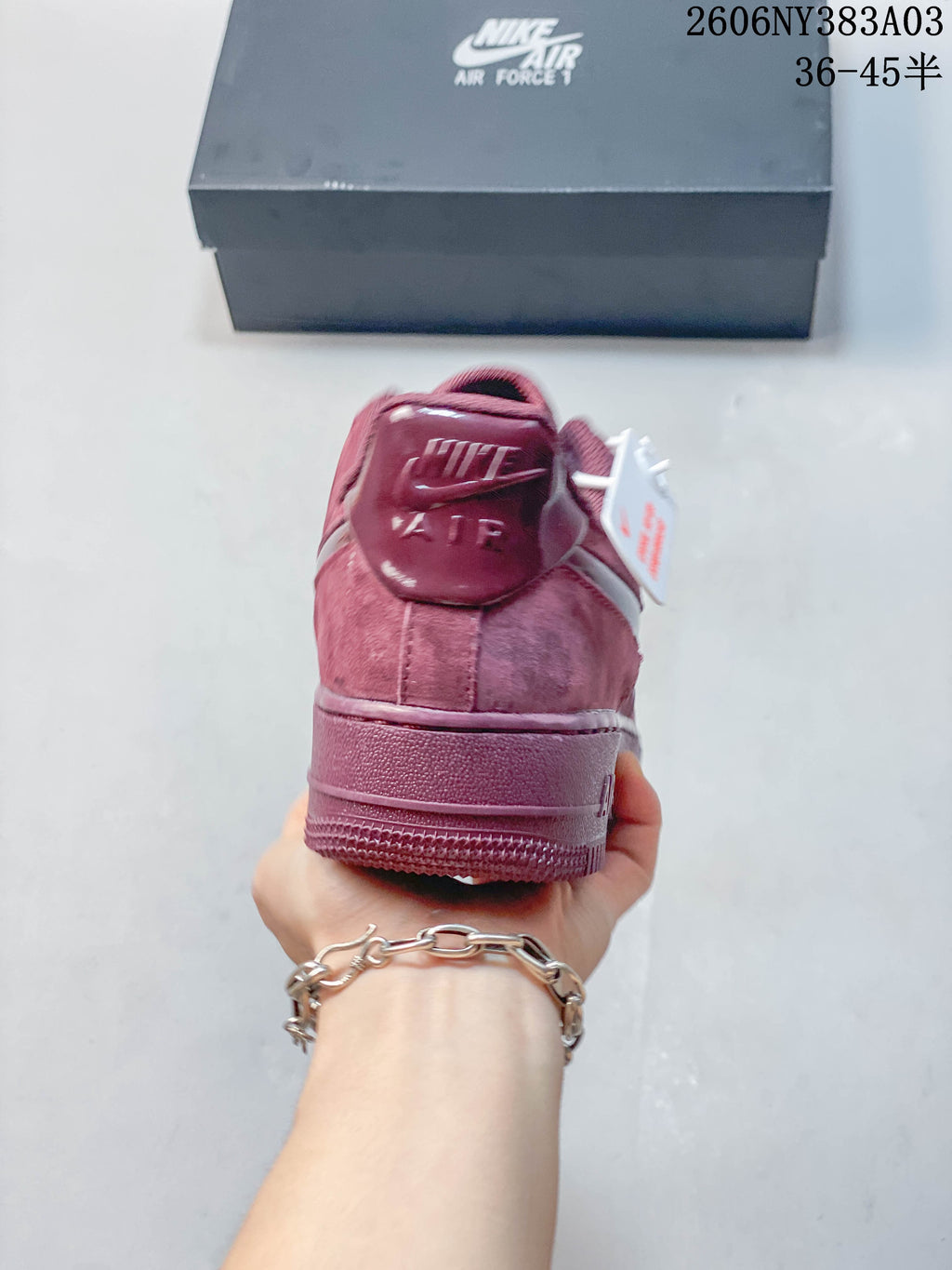 Rear view of a dusty rose low-top sneaker showing the heel and outsole