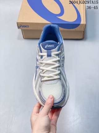 Front view showing the rounded toe, mesh-style vamp, laces and padded tongue.