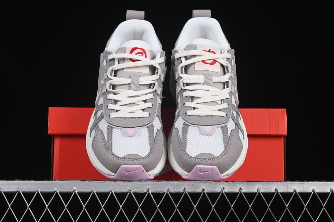 Front view of the pair showing toe panels, laces, and pink details