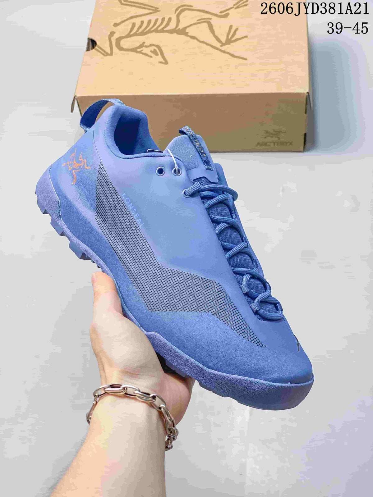 Blue Arc'teryx Konseal shoe with a contrasting textured side panel