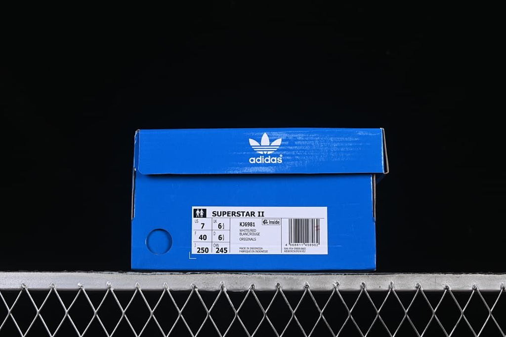 Blue adidas shoe box label identifying Superstar II, model KJ6981, and the photographed size.