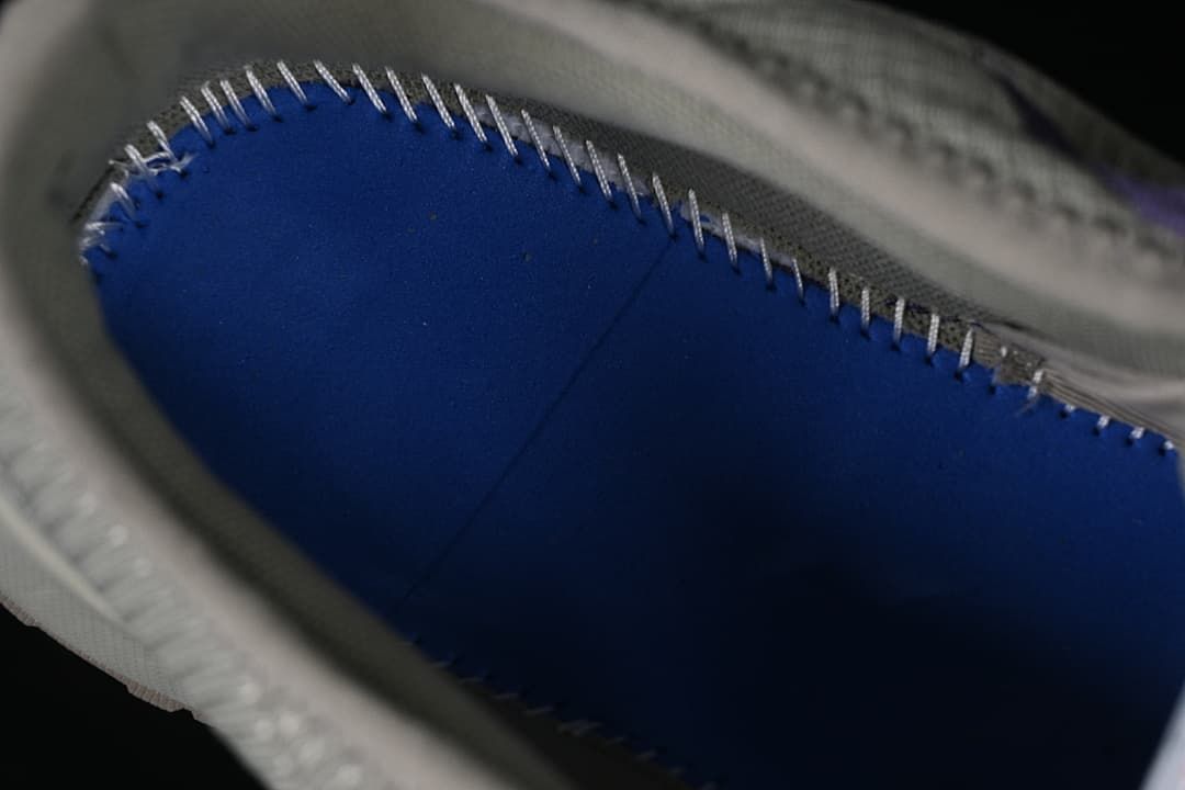 Close-up of stitching and interior lining.