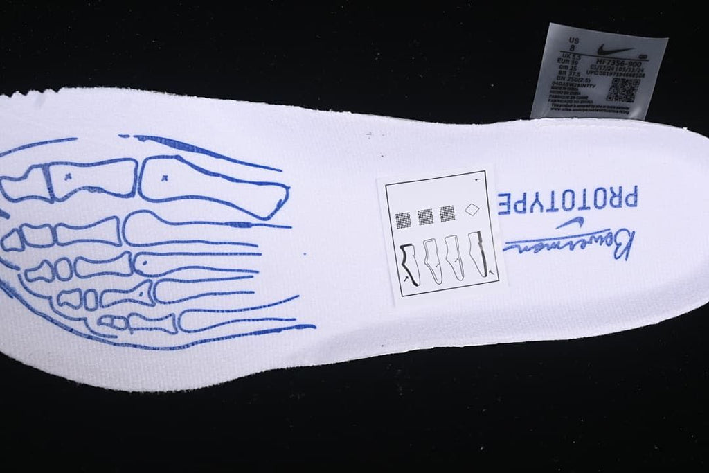White insole with blue graphic and a photographed shoe size label