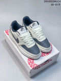 Pair of off-white and slate-blue Nike Court Vision low-top sneakers on a Year of the Snake 2025 box