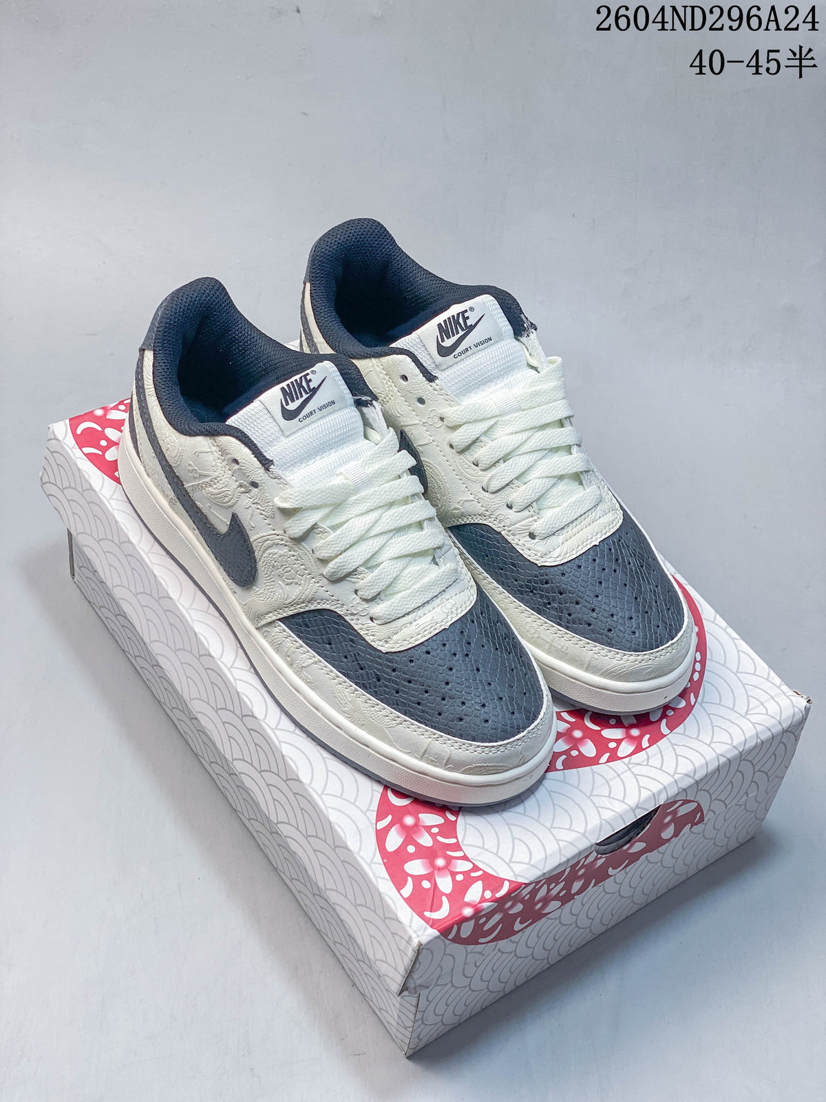 Pair of off-white and slate-blue Nike Court Vision low-top sneakers on a Year of the Snake 2025 box