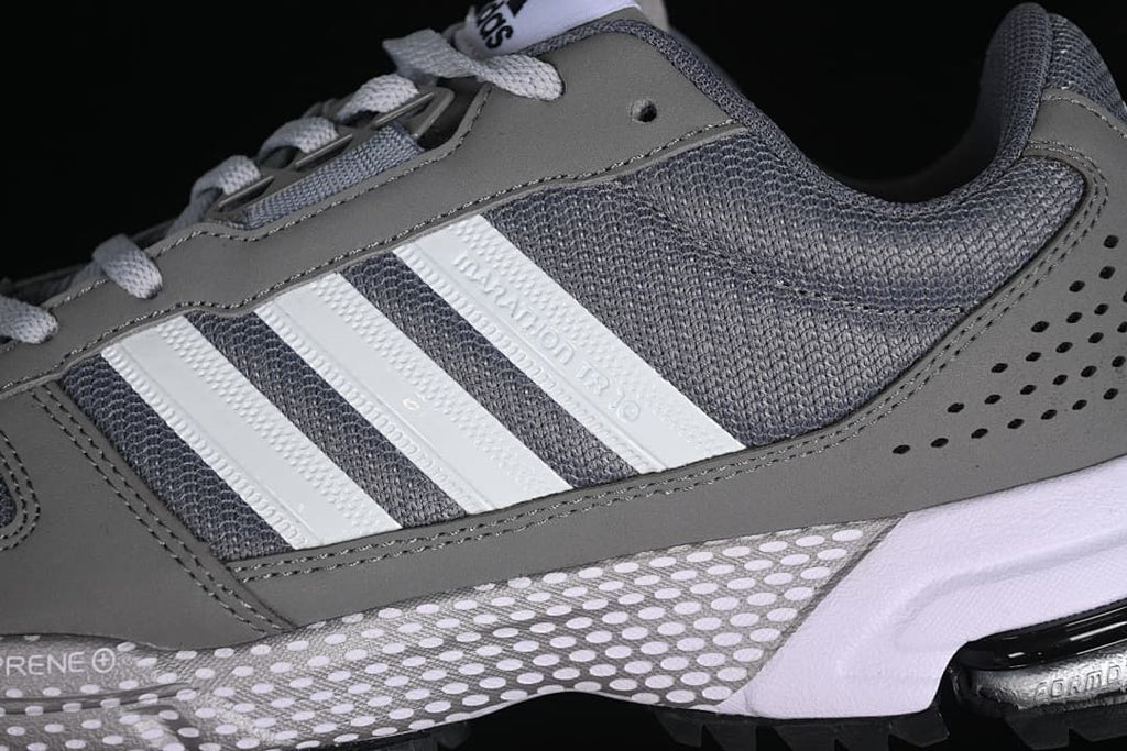 Close-up of the side stripes, mesh panels, and gray overlays