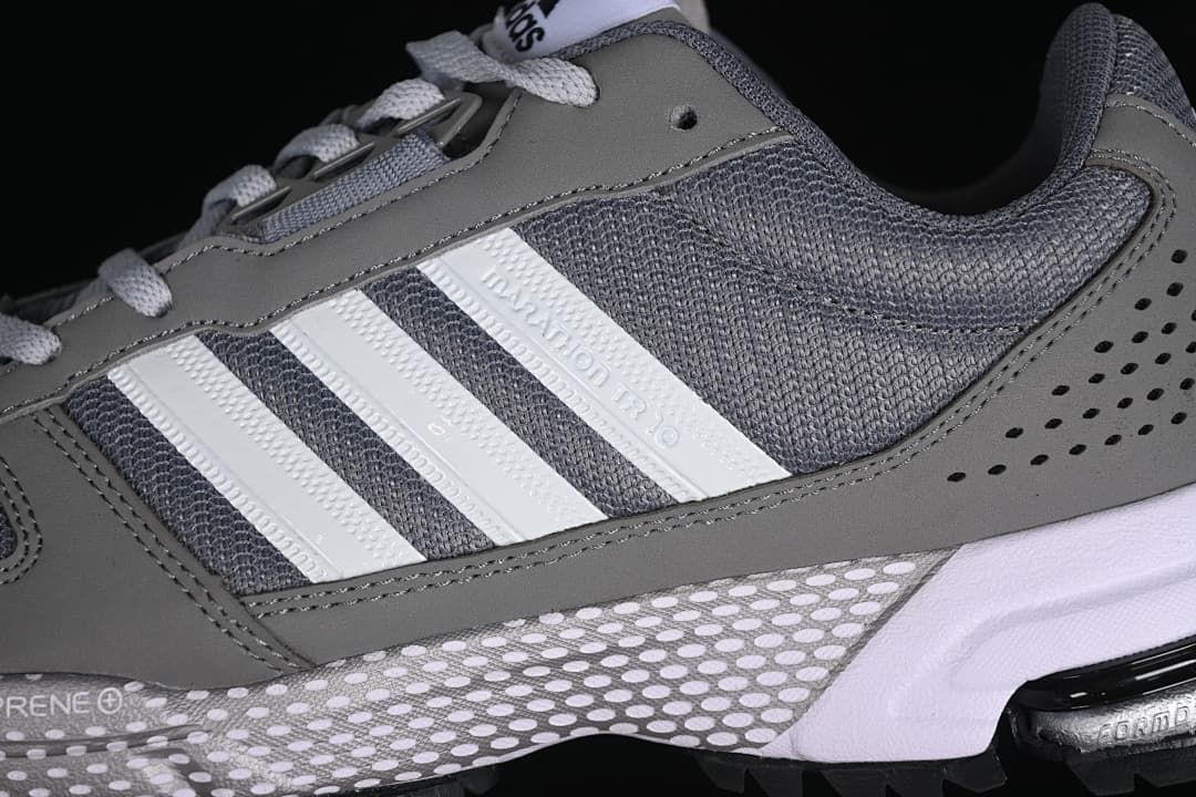 Close-up of the side stripes, mesh panels, and gray overlays
