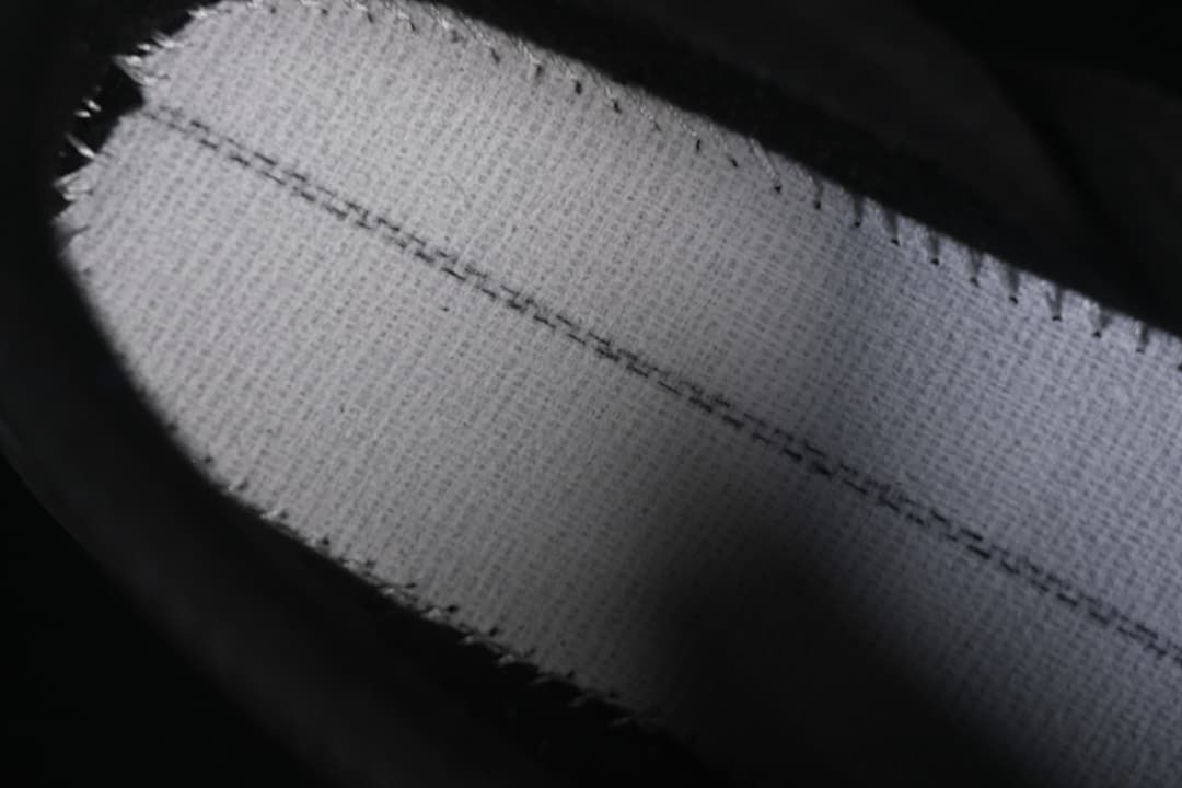 Close-up of a light-colored woven textile detail