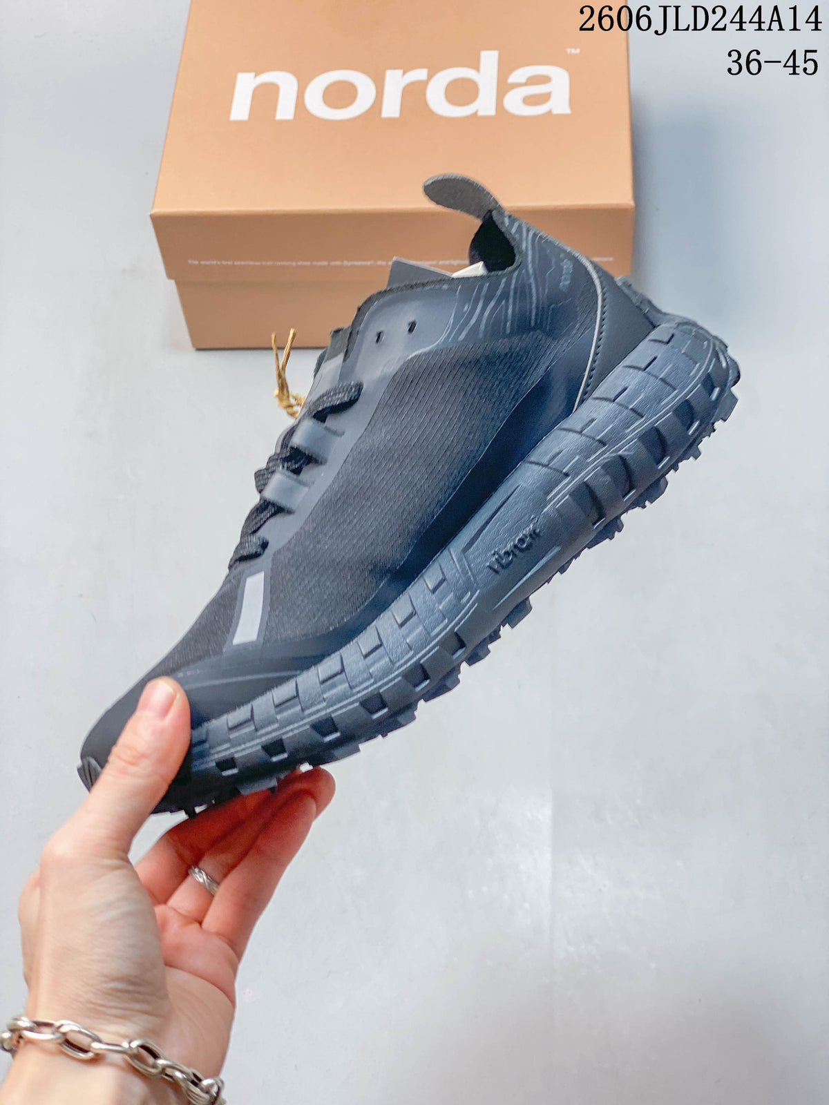 Side view of the black norda 001 showing its low-top profile, lace-up design and thick treaded outsole.