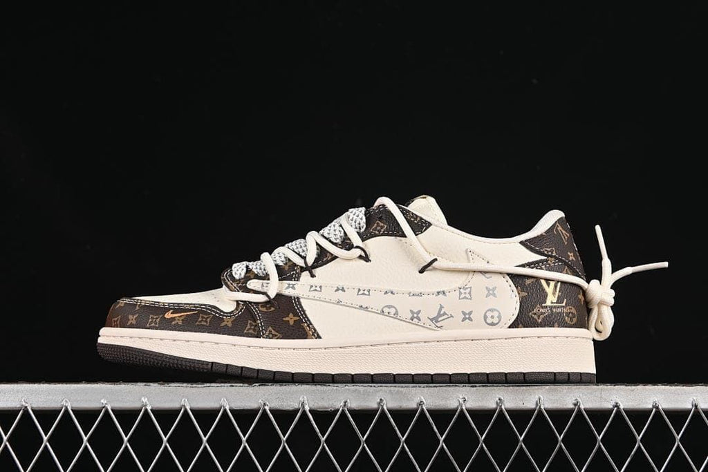 Side view of a cream and dark brown low-top sneaker with patterned panels and a tied heel lace accent
